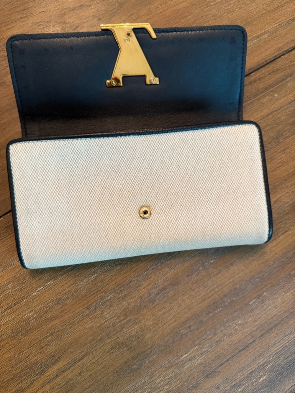 Louis Vuitton Capucines Wallet with Black Trim and Gold LV Emblem - Picture 9 of 10